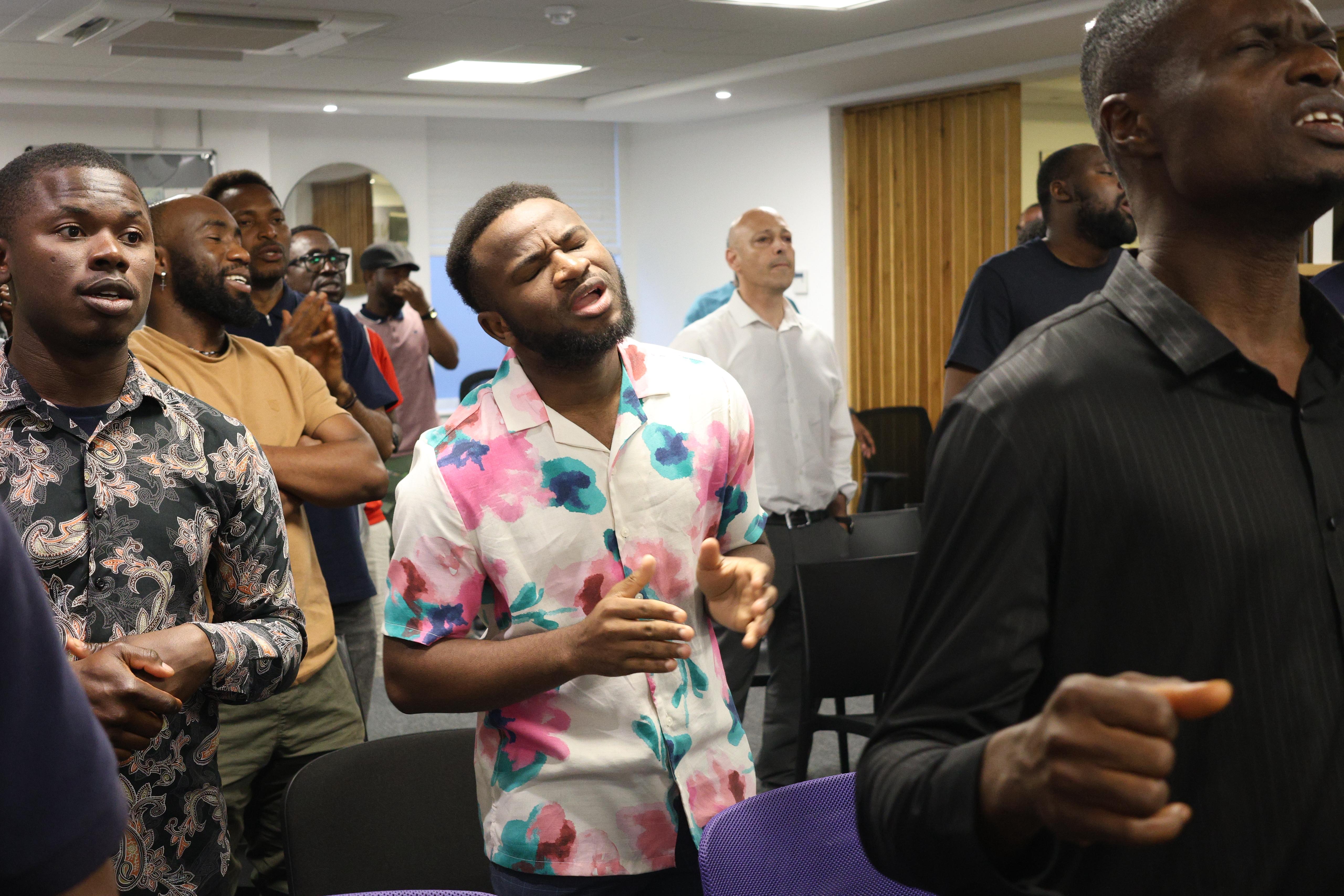 Men gathering in prayer